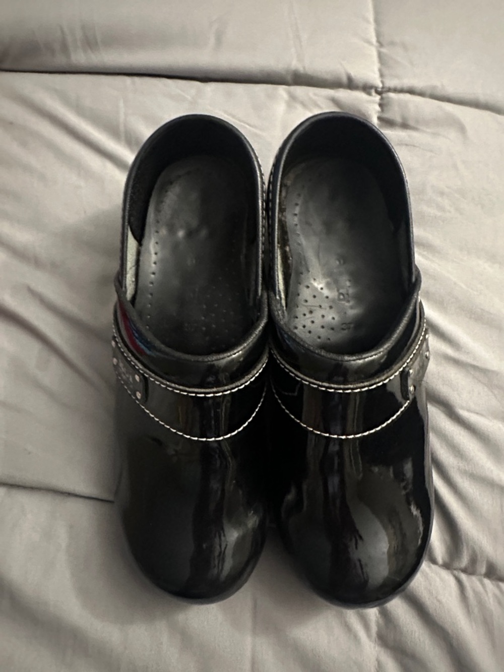 Sanita Black Patent Slip-On Clogs with Decorative Strap